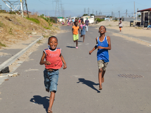 kids running down a street