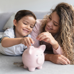 mother and son with piggy bank
