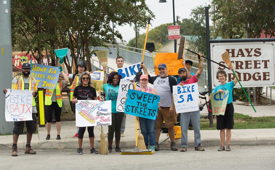 Bike S.A. volunteers holding signs advocating for clean and safe streets